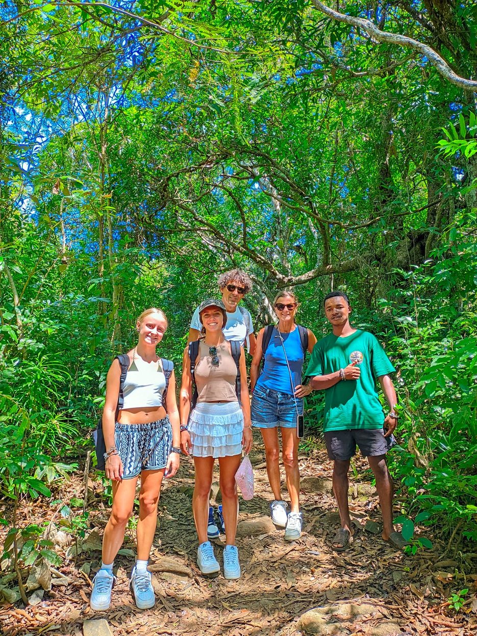 Small group of guests with their guide on a forest trail in Lokobe